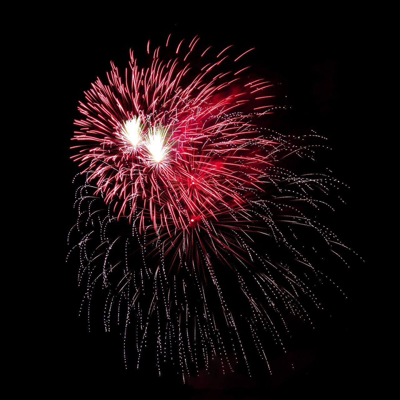 fireworks, celebration, firework display, motion, event, night, exploding, illuminated, arts culture and entertainment, glowing, recreation, low angle view, no people, sky, nature, firework - man made object, long exposure, blurred motion, multi colored, red, outdoors, dark