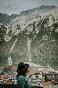 Rear view of man looking at mountains