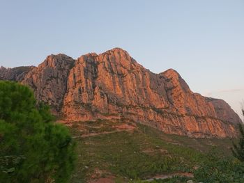 Scenic view of rocky mountains against clear sky