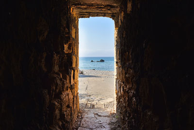 Sea view through ancient tunnel. cyprus island