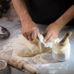 Cropped hands of chef preparing food