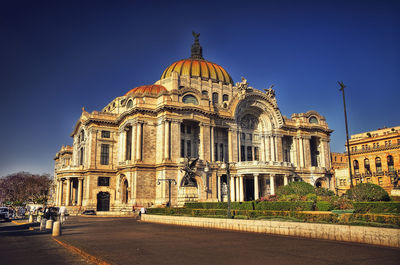 Facade of historic building against blue sky