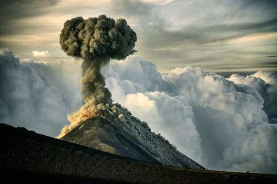 Scenic view of volcanic mountain against sky