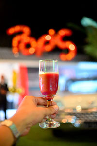 Close-up of hand holding wineglass