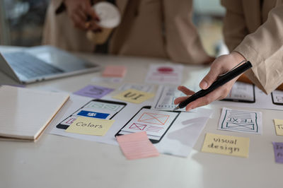 Midsection of business colleagues working at office