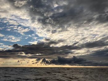 Scenic view of sea against dramatic sky