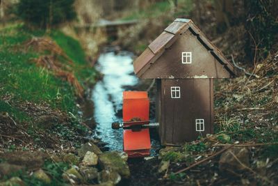 Miniature of a water mill on a stream