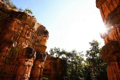 Low angle view of rock formation against sky