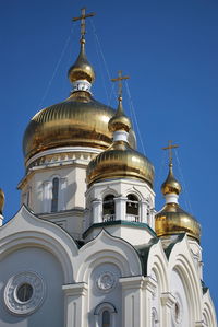 Low angle view of building against blue sky