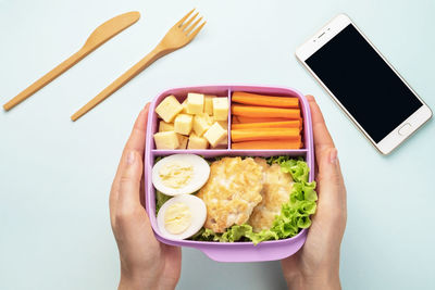 Midsection of person holding ice cream in plate