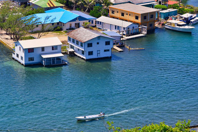 High angle view of buildings by sea