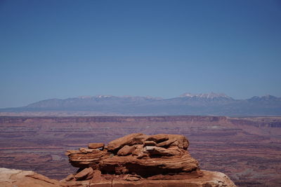 Rock formations in desert against clear sky