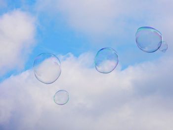 Soap bubbles flying in the sky