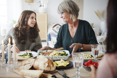 Family eating dinner at home together