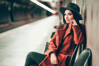 Portrait of woman sitting on chair