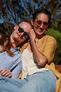 Low angle view of young woman holding hands