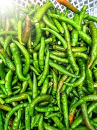 Full frame shot of green chili peppers for sale at market