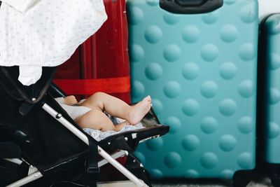 Low section of woman sitting on chair