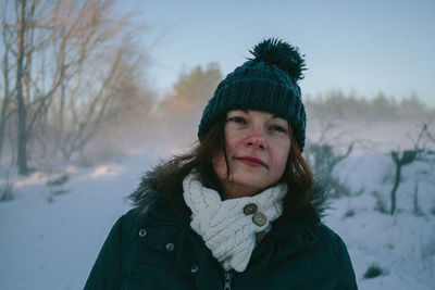 Close-up of woman looking away during winter