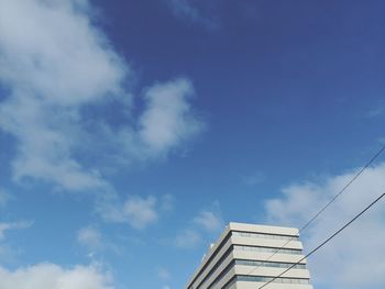 Low angle view of building against blue sky