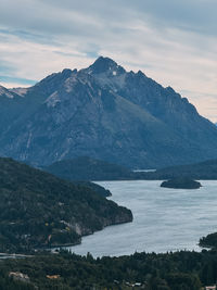 A mountain range with a lake in the valley below. 