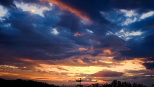 Scenic view of dramatic sky at sunset