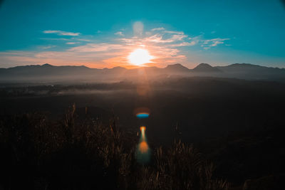 Scenic view of landscape against sky during sunset