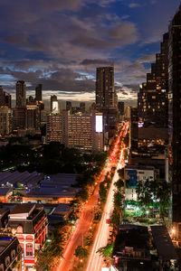 High angle view of illuminated buildings in city at night