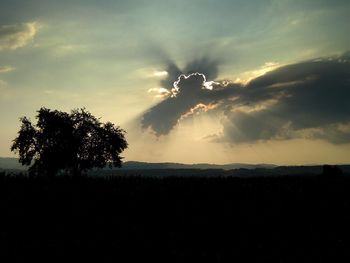 Scenic view of landscape against sky at sunset