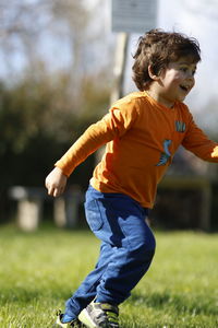 Side view of boy holding hands