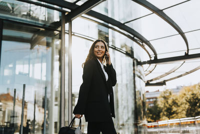 Portrait of a young woman standing outdoors