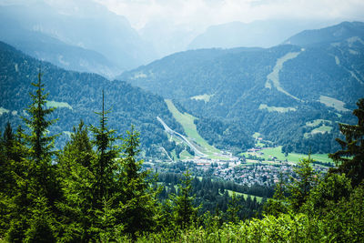 High angle view of trees and mountains against sky