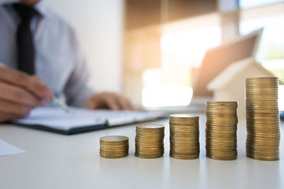 Stack of coins on table
