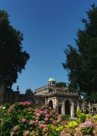 Low angle view of building against clear blue sky