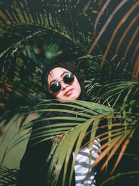 Low angle view of woman wearing sunglasses