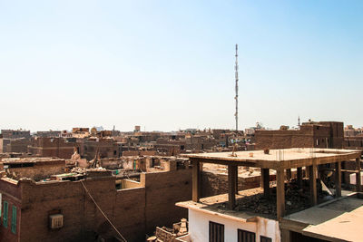 High angle view of buildings against clear sky