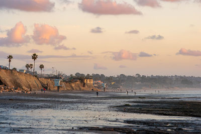 Scenic view of beach against sky during sunset