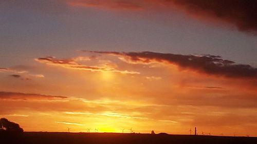 Low angle view of dramatic sky during sunset