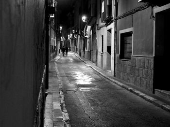 Alley amidst buildings in city