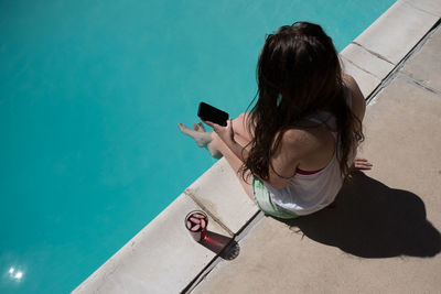 High angle view of woman using mobile phone