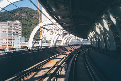 Train on railroad tracks in city