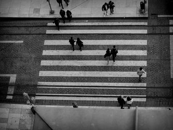 High angle view of people walking on street in city