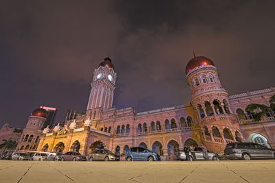 Low angle view of illuminated buildings at night