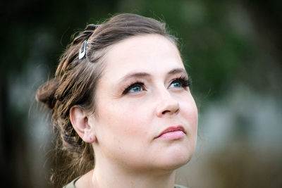 Close-up portrait of woman looking away