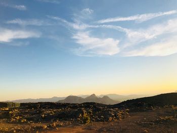 Scenic view of landscape against sky during sunset