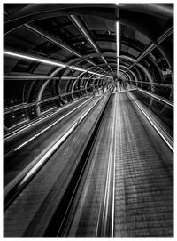 Illuminated railroad tracks at subway station