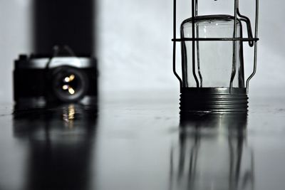 Close-up of wet glass on table