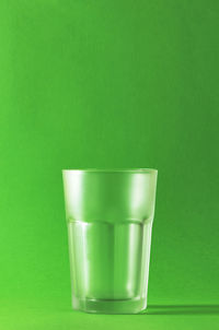 Close-up of drink against green background
