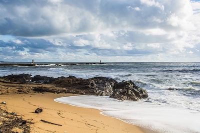 Scenic view of beach against sky