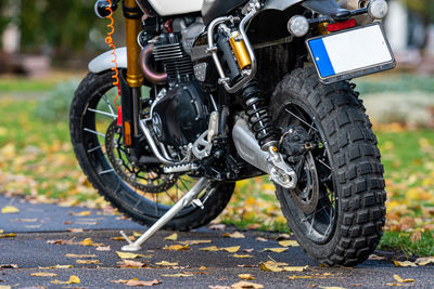 Close-up of motorcycle on road